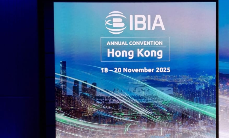 A conference display screen showing the IBIA Annual Convention Hong Kong event information dated 18–20 November 2025.