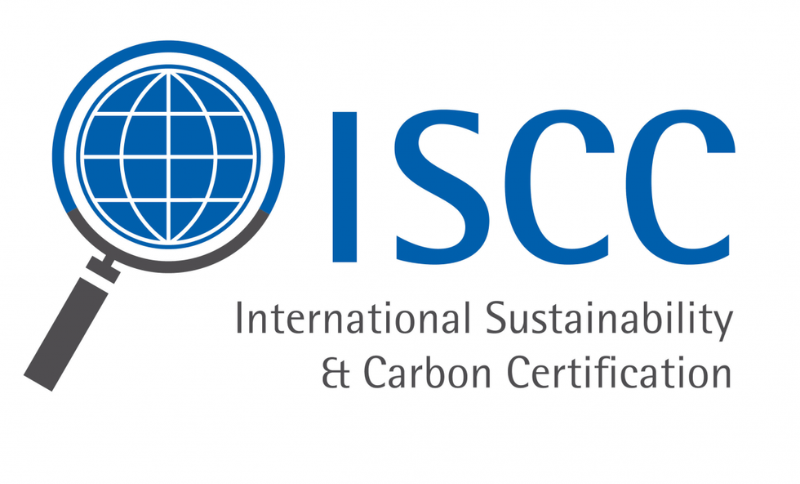 ISCC International Sustainability and Carbon Certification logo featuring a magnifying‑glass globe graphic and text displayed on a white background.