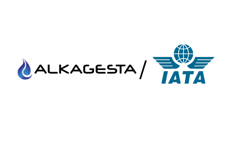The Alkagesta logo displayed alongside the IATA logo on a white background, indicating a partnership or association between Alkagesta and the International Air Transport Association.