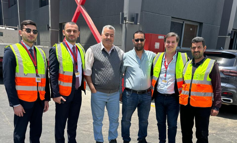 Alkavex delegation and local partners wearing safety vests during a site visit in Cairo.