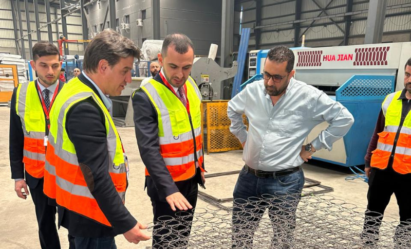 Alkavex representatives and local partners reviewing steel wire products during a factory site visit in Cairo.