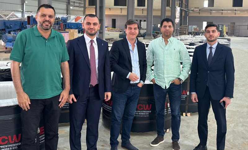 Alkavex representatives and local partners standing inside a Cairo steel manufacturing facility during a site visit.