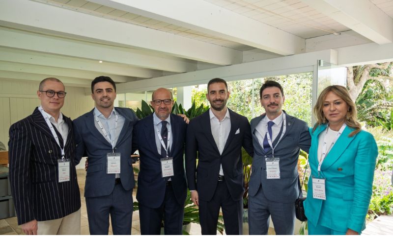 Alkagesta representatives at JP Shipping Seminar 2026 in Sardinia during networking session wearing event badges