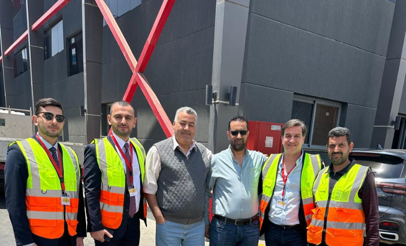Alkavex delegation and local partners wearing safety vests during a site visit in Cairo.