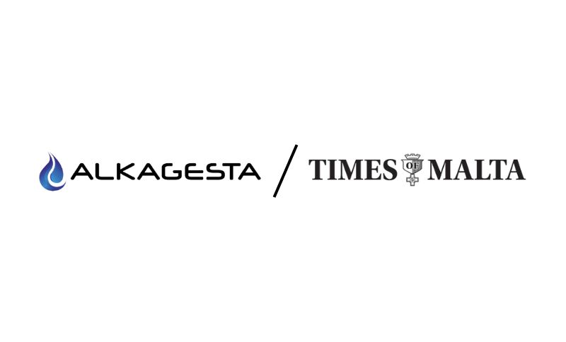The Alkagesta logo with a blue flame icon appears on the left, separated by a diagonal line from the Times of Malta logo with a crest symbol on the right, both on a white background.