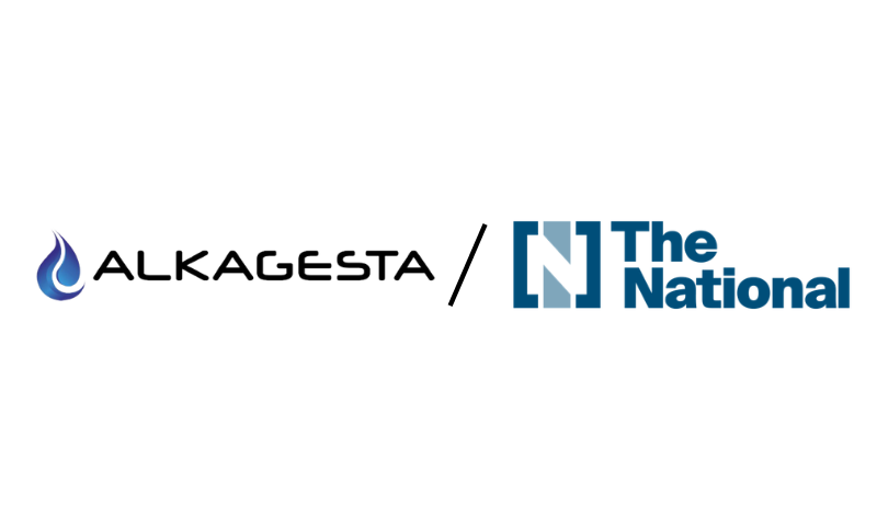 Logos of Alkagesta, with a blue water droplet icon, and The National, with a blue N in a square, separated by a diagonal slash on a white background.