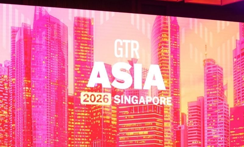 Brightly lit pink and orange city skyline backdrop with GTR ASIA 2026 SINGAPORE written in bold white text across the centre.